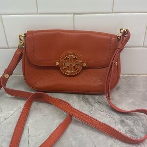 Orange Tory Burch purse. Removable straps. Small purse. Hardly ever worn.